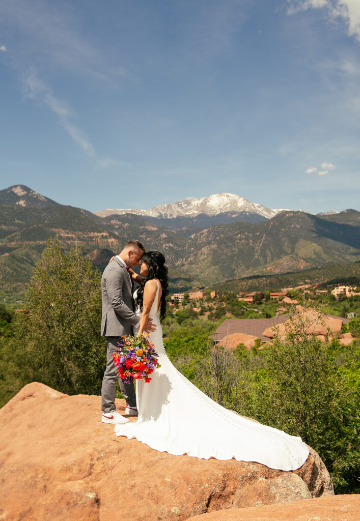 Garden of the Gods elopement ceremony with Pikes Peak in background
